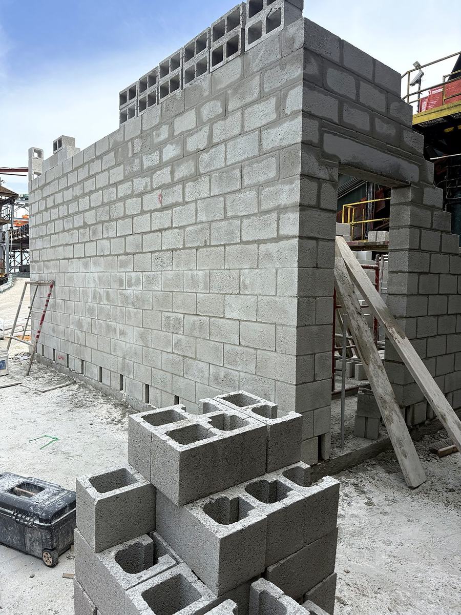 Concrete block CMU walls under construction for a future MCC motor control center room