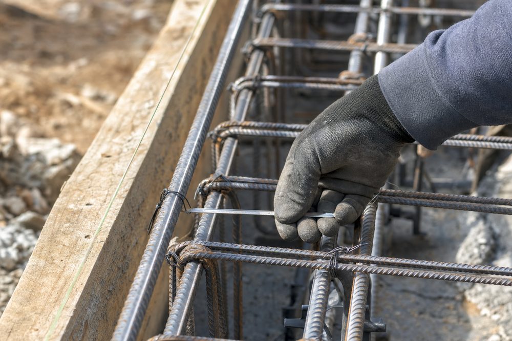 Rebar reinforcement and concrete formwork on a construction site foundation